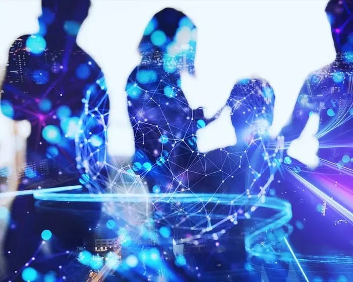 Silhouettes of people against a vibrant, digitally-enhanced backdrop featuring blue and purple network connections and city lights.