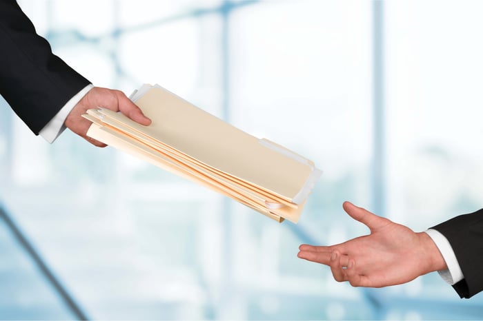 hands-businessmen-holding-documents-background-1