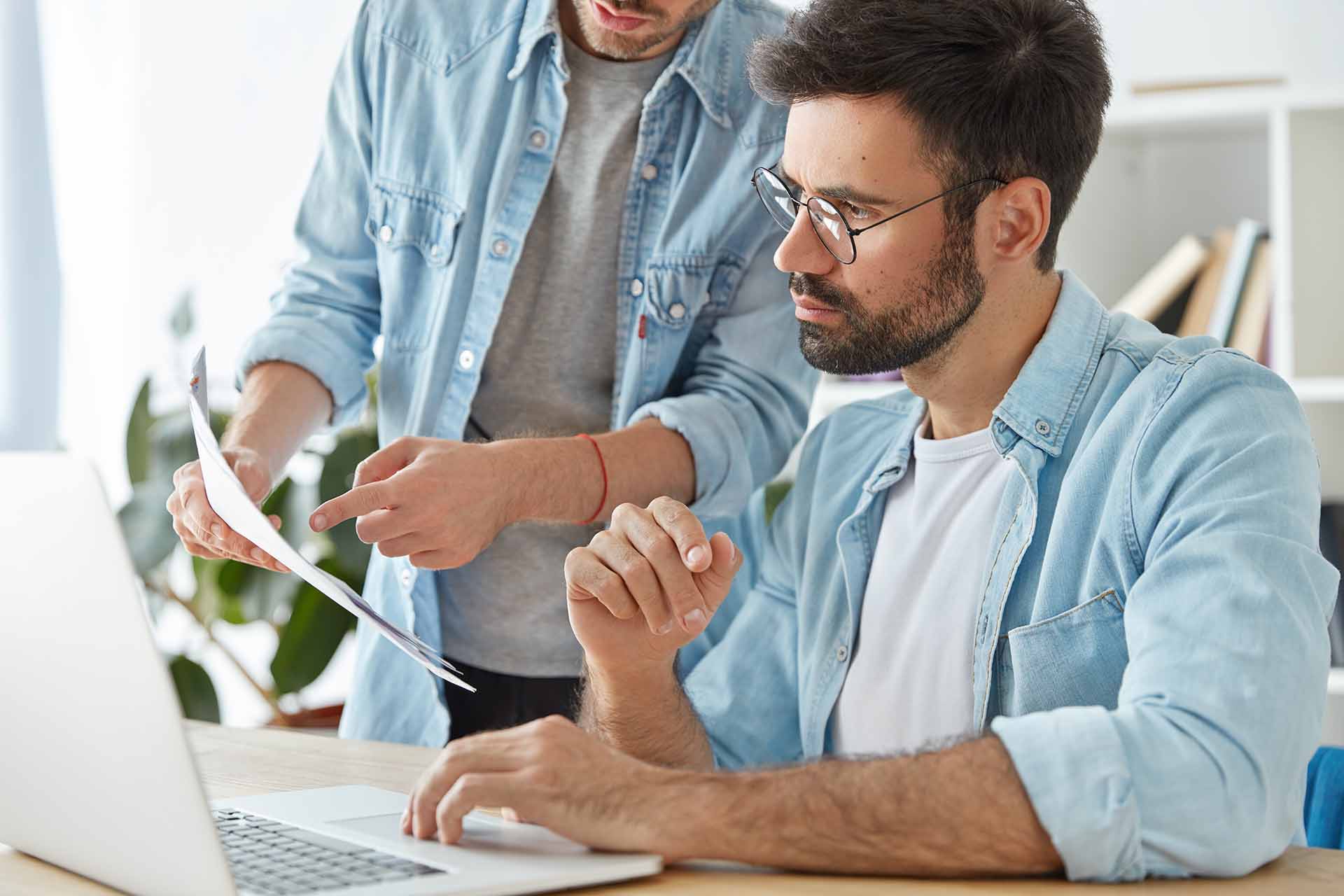 two-business-young-successful-workers-collaborate-together-coworking-space