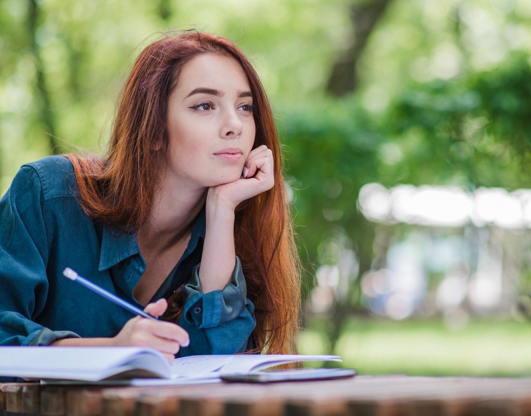 woman-in-park-writing